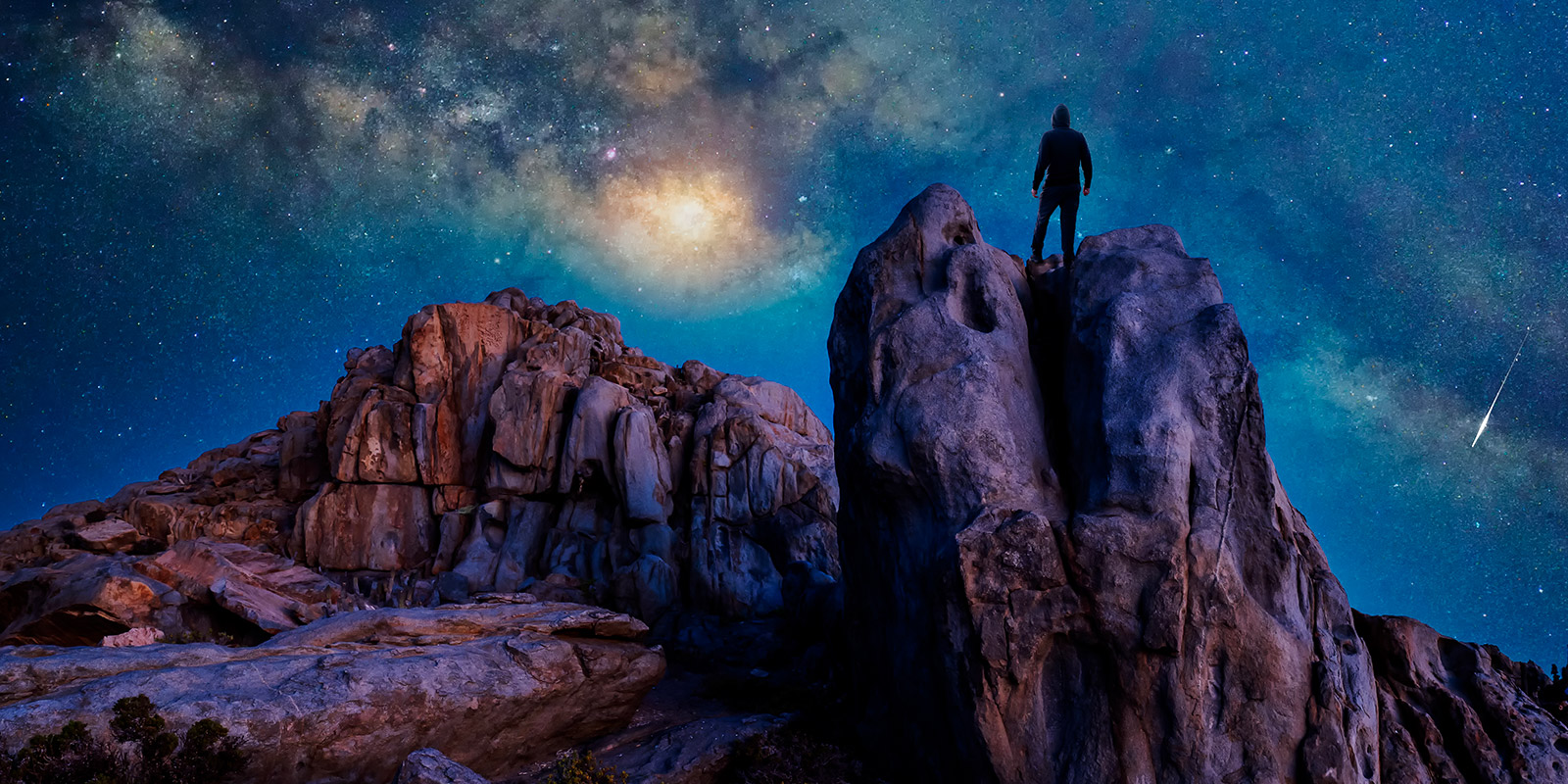 silhouette person standing rock night with milky way background